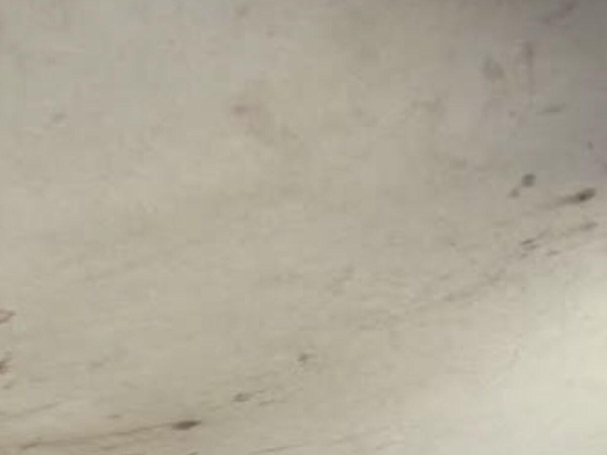 Stained vehicle headliner before professional cleaning